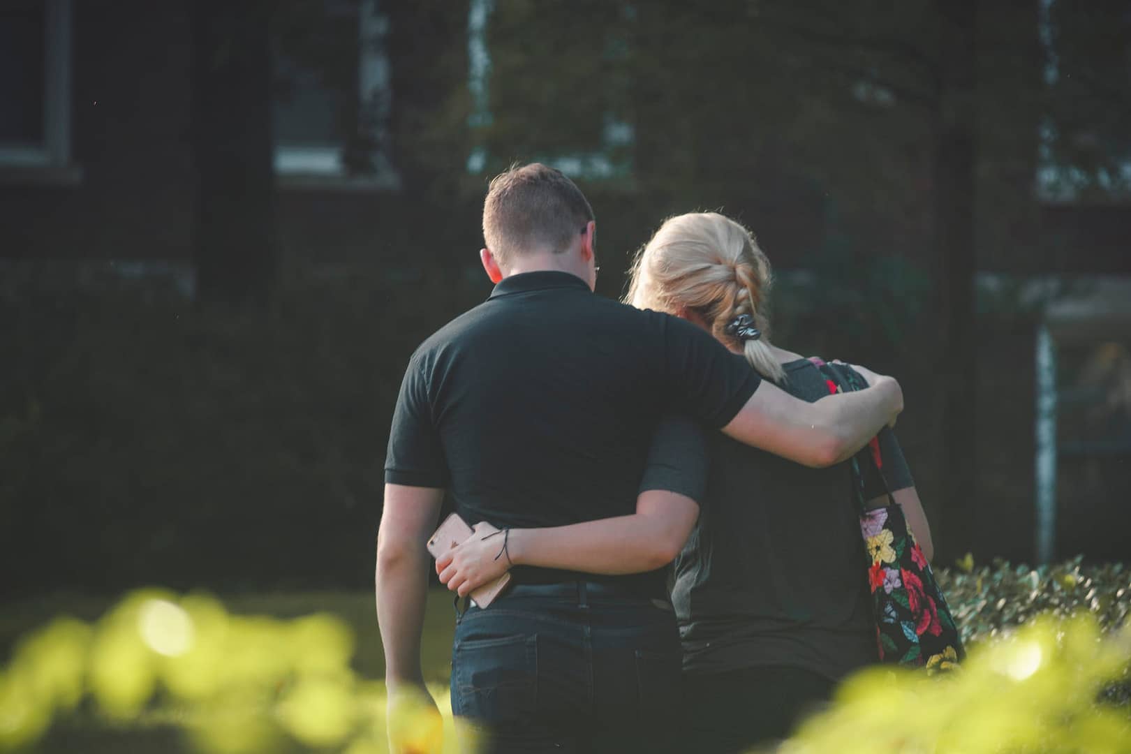 couple walking toward building